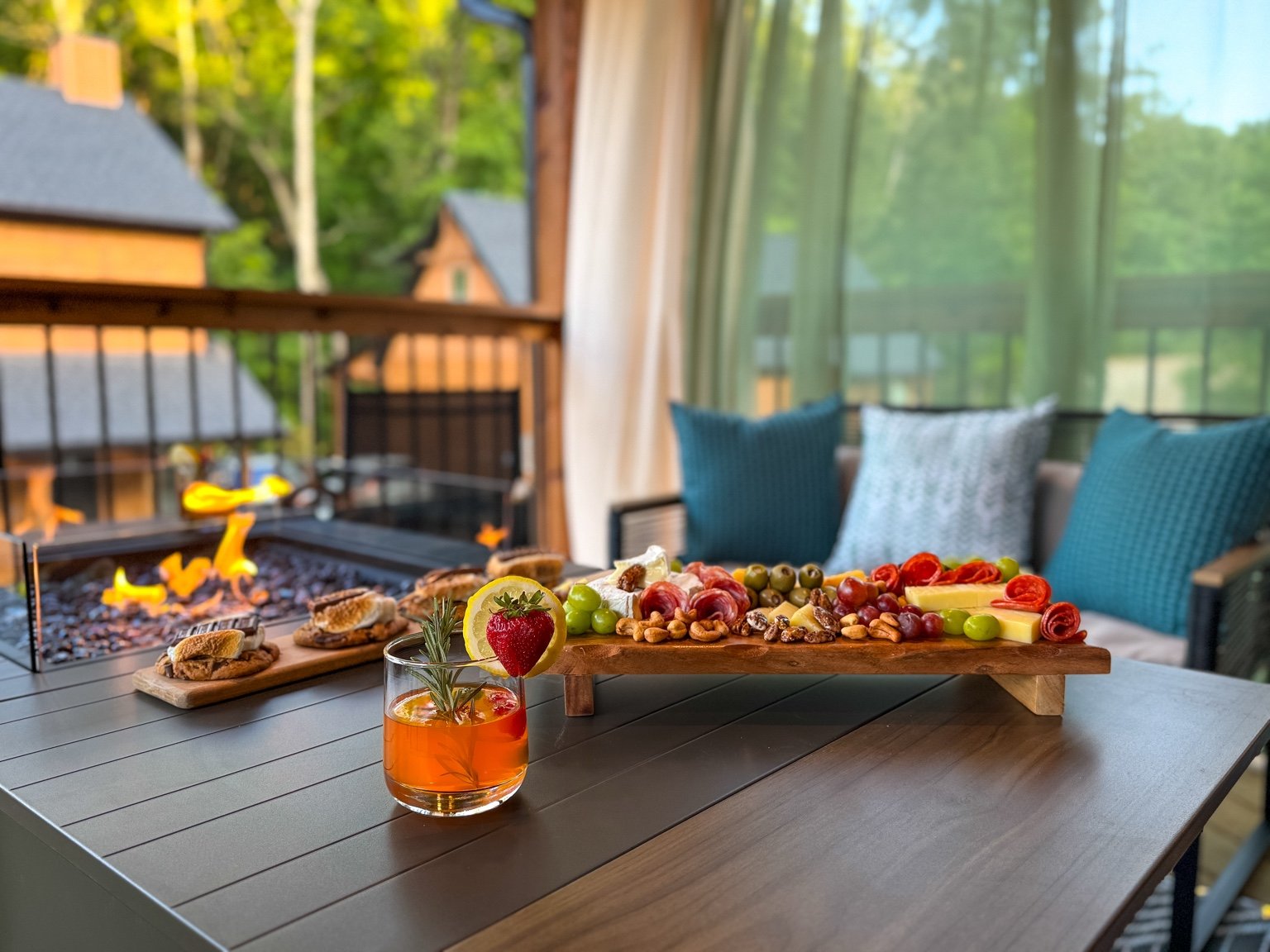 Vacation rental outdoor fire pit, charcuterie board and cocktail photographed by Pic Me STR Photography